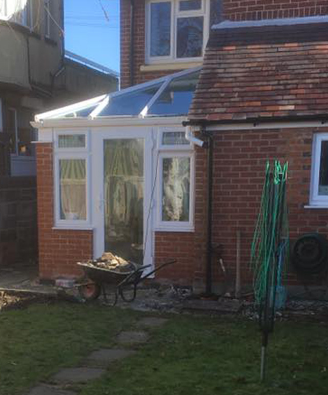 Conservatory extension red brick to match house.