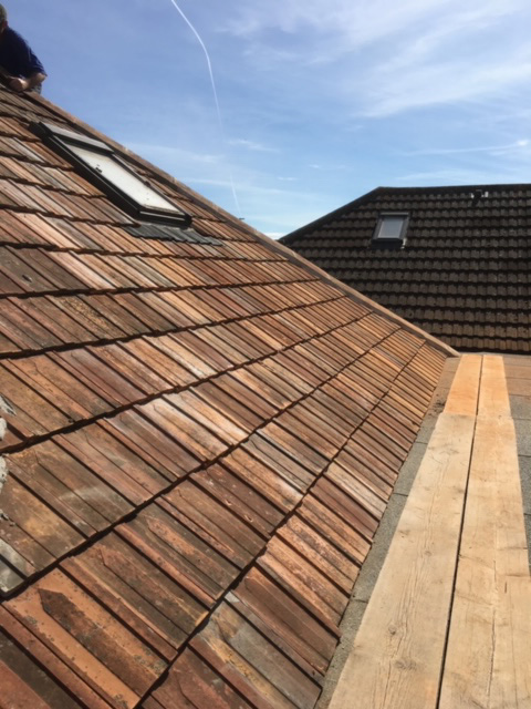 Repaired roofing tiles from the right.